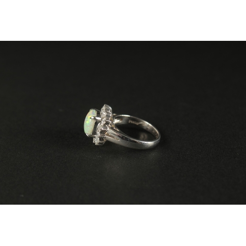 1011 - A PLATINUM RING set with a cabochon oval opal and a halo of RBC diamonds in a small ring size. Opal ... 