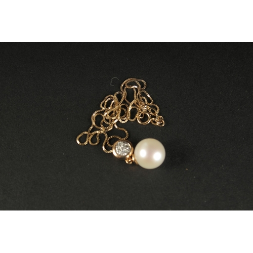 1015 - A 9CT YELLOW GOLD CULTURED PEARL AND DIAMOND BALE PENDANT with 9ct yellow gold box link chain, boxed... 