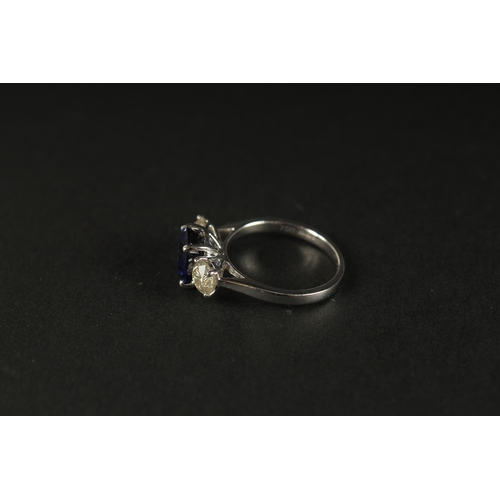 1016 - A CERTIFICATED 18CT WHITE GOLD SYNTHETIC SAPPHIRE AND DIAMOND TRILOGY RING. Oval sapphire 2.87ct. RB... 