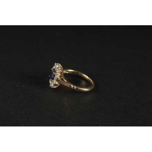 1019 - A 9CT YELLOW GOLD RING set with oval sapphire and a halo of RBC diamonds, boxed. Sapphire 1.00ct app... 