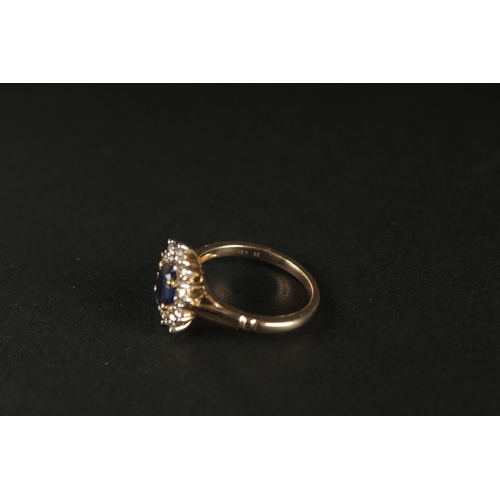 1019 - A 9CT YELLOW GOLD RING set with oval sapphire and a halo of RBC diamonds, boxed. Sapphire 1.00ct app... 