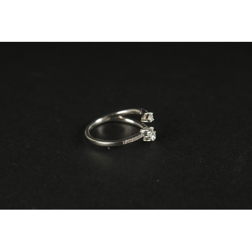 1023 - A 10CT WHITE GOLD (TESTED AS 9CT) TRIDENT-STYLE DIAMOND RING. Pear-cut and RBC diamonds 0.40ct appro... 