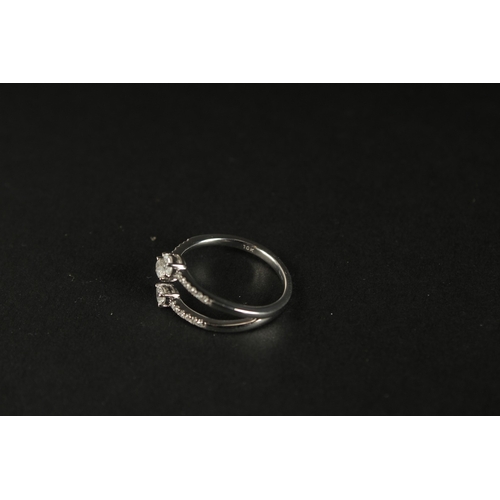 1023 - A 10CT WHITE GOLD (TESTED AS 9CT) TRIDENT-STYLE DIAMOND RING. Pear-cut and RBC diamonds 0.40ct appro... 