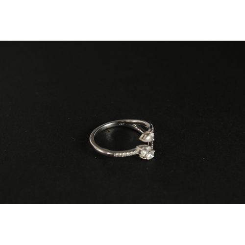 1023 - A 10CT WHITE GOLD (TESTED AS 9CT) TRIDENT-STYLE DIAMOND RING. Pear-cut and RBC diamonds 0.40ct appro... 