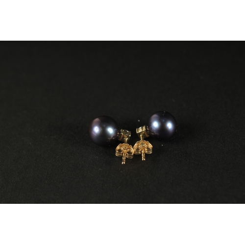 1025 - A PAIR OF 9CT YELLOW GOLD BLUE/PURPLE PEARL STUDS set with 0.26ct diamonds, boxed.