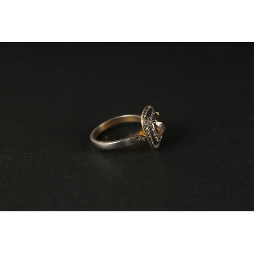 1026 - A SILVER GILT DRESS RING set with a central fancy brown rose-cut cushion-shaped diamond and two halo... 