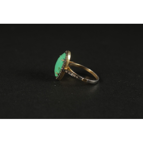 1027 - A DRESS RING set with a central chrysoprase and rose-cut diamonds in silver gilt. Oval cabochon chry... 