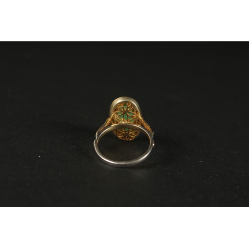 1027 - A DRESS RING set with a central chrysoprase and rose-cut diamonds in silver gilt. Oval cabochon chry... 