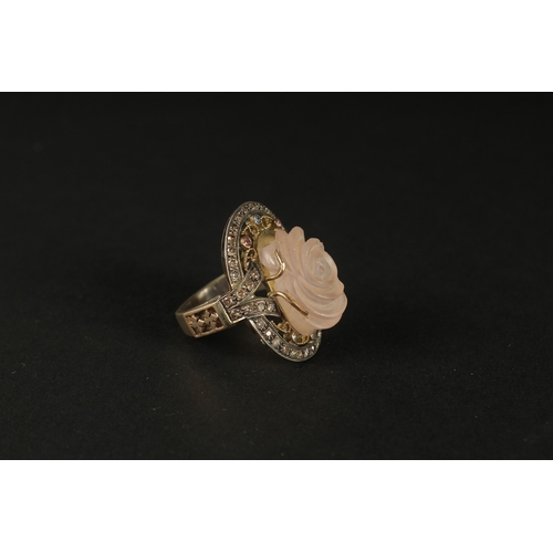 1028 - A LARGE AND IMPRESSIVE SILVER GILT RING set with a large carved rose quartz and coloured diamonds, b... 