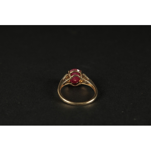 1039 - A 9CT YELLOW GOLD OVAL RUBY RING with diamonds set to the shoulders, boxed.