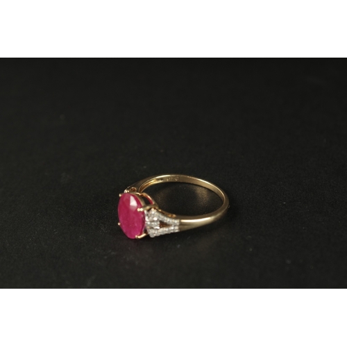 1039 - A 9CT YELLOW GOLD OVAL RUBY RING with diamonds set to the shoulders, boxed.