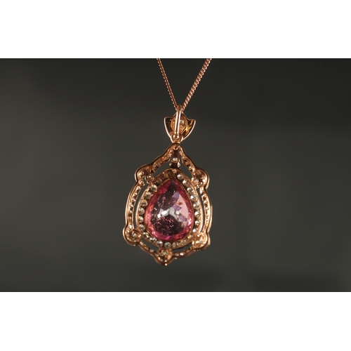 1041 - AN 18CT ROSE GOLD PENDANT set with large pear-shaped pink tourmaline surrounded by RBC diamonds with... 