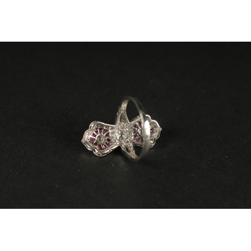 1051 - A PLATINUM EDWARDIAN-STYLE RUBY AND DIAMOND PINCHED DESIGN RING. Central old-cut diamond and two lar... 