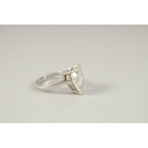 1054 - A SUPERB PEAR-SHAPED DIAMOND RING. APPROX. 5CTS, SET IN PLATINUM.