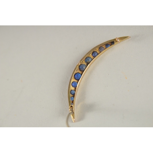 1055 - A GOLD, DIAMOND AND SAPPHIRE CRESCENT BROOCH.