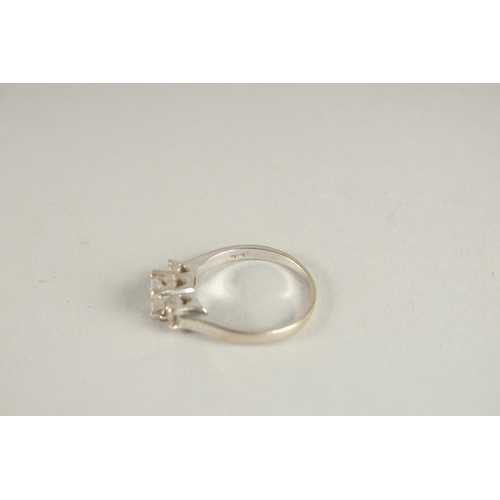 1056 - A 14CT WHITE GOLD THREE STONE DIAMOND RING.