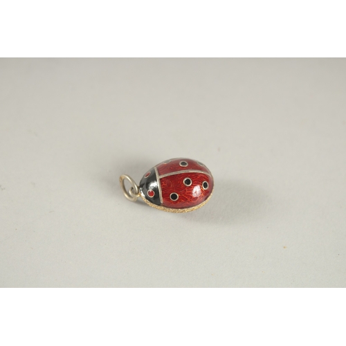 1061 - A SILVER LADYBIRD PENDANT.