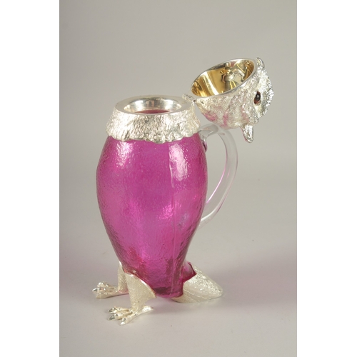 1120 - A SILVER-PLATED AND CRANBERRY GLASS OWL CLARET JUG. 11.5ins high.