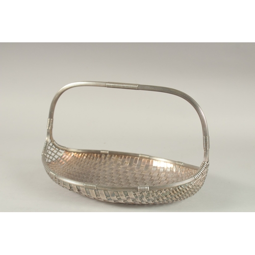 1133 - A WMF SILVER PLATED BASKET WEAVE FORM BASKET with strap handle. 33cms long.