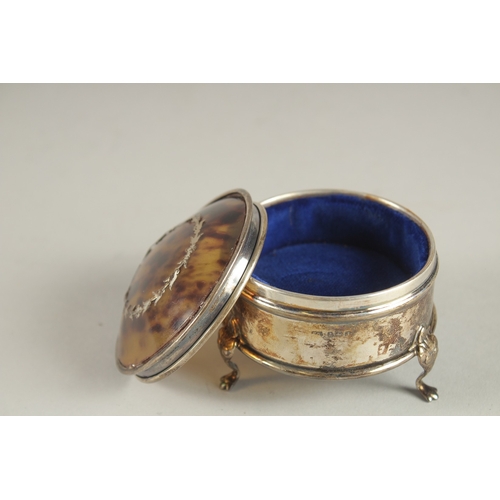 1155 - A SILVER AND TORTOISESHELL CIRCULAR PIN BOX with blue liner, on three claw feet. 2.5ins. Birmingham ... 