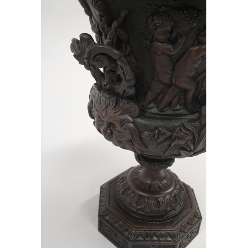 508 - A GOOD PAIR OF 18TH CENTURY IRISH DESIGN MAHOGANY TWO-HANDLED URNS AND COVERS, carved with cupids, s... 