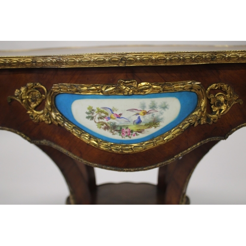 512 - A GOOD 19TH CENTURY KINGWOOD LEATHER TOP OVAL TABLE, the sides with Sevres porcelain panels, ormolu ... 