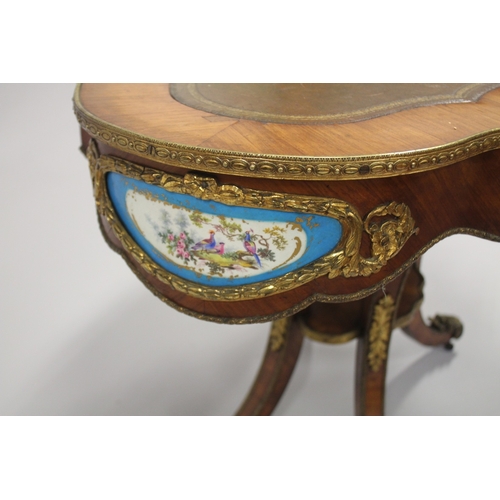 512 - A GOOD 19TH CENTURY KINGWOOD LEATHER TOP OVAL TABLE, the sides with Sevres porcelain panels, ormolu ... 