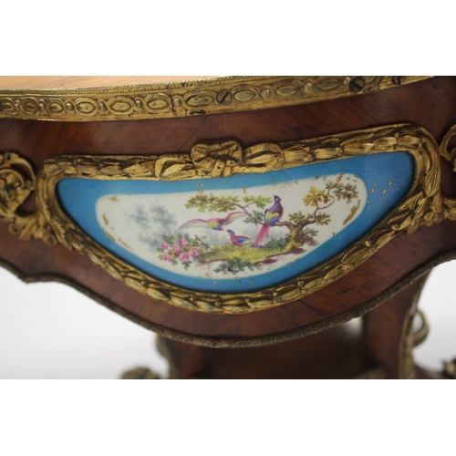 512 - A GOOD 19TH CENTURY KINGWOOD LEATHER TOP OVAL TABLE, the sides with Sevres porcelain panels, ormolu ... 