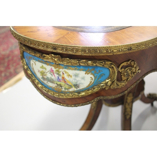 512 - A GOOD 19TH CENTURY KINGWOOD LEATHER TOP OVAL TABLE, the sides with Sevres porcelain panels, ormolu ... 