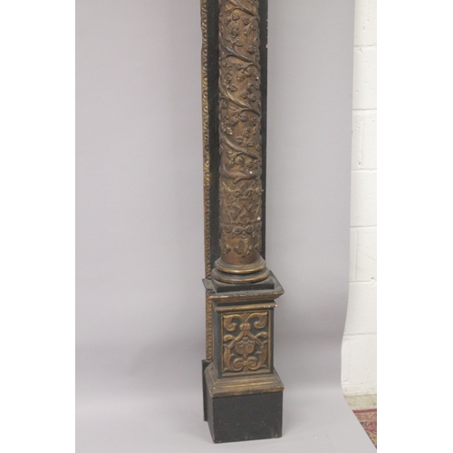 513 - A LARGE LATE 17TH CENTURY - EARLY 18TH CENTURY CARVED WOOD DOOR FRAME with a large pair of carved co... 