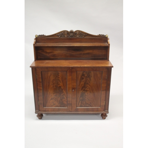 518 - A LATE REGENCY MAHOGANY CHIFFONIER with shaped back, single shelf over a pair of double doors, on tu... 