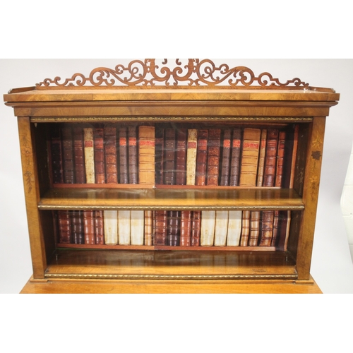 520 - A 19TH CENTURY WALNUT STANDING BOOKCASE, the top with pierced fretwork, single shelf and faux books,... 