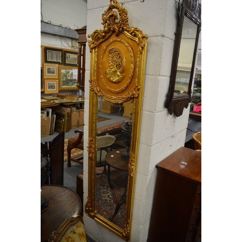 524 - A PAIR OF FRENCH STYLE GILDED NARROW WALL MIRRORS.