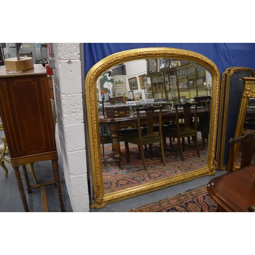 525 - A LARGE VICTORIAN STYLE GILT-FRAMED OVERMANTLE MIRROR. 150cm high x 160cm wide.