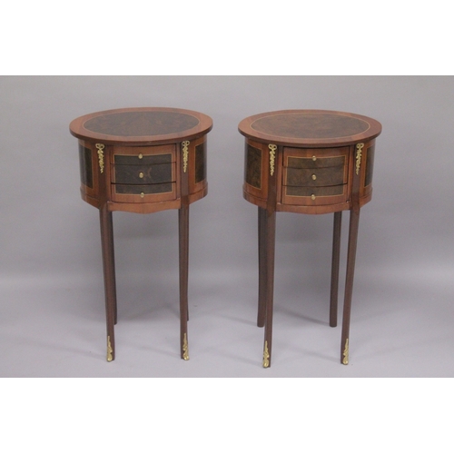 533 - A PAIR OF LOUIS XVITH STYLE INLAID OVAL BEDSIDE CUPBOARDS with three drawers. 27ins high x 15.5ins w... 