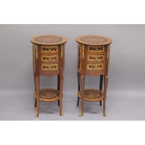 534 - A PAIR OF LOUIS XVITH STYLE INLAID CIRCULAR BEDSIDE CUPBOARDS with three drawers and an under-tier. ... 