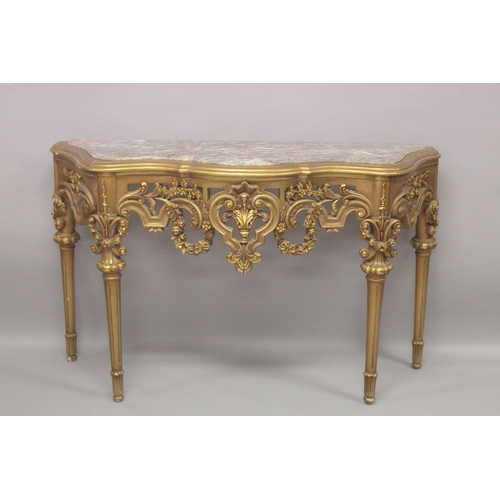 541 - A GOOD LOUIS XVITH STYLE GILTWOOD CONSOLE AND MIRROR with marble top with urns, flowers and column s... 