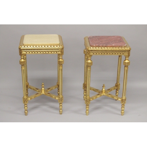 552 - TWO MARBLE TOP SQUARE GILTWOOD TABLES, on fluted legs with under-tier. 28ins high x 15ins square.... 