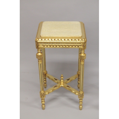 552 - TWO MARBLE TOP SQUARE GILTWOOD TABLES, on fluted legs with under-tier. 28ins high x 15ins square.... 