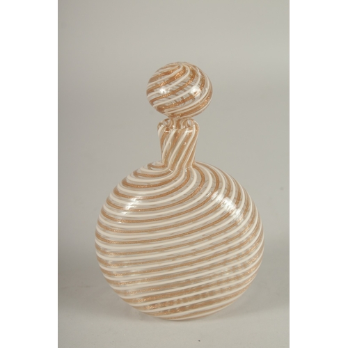 571 - A VENINI GLASS FLASK WITH STOPPER, decorated with swirling bands of gold and opaque white. 15cms hig... 