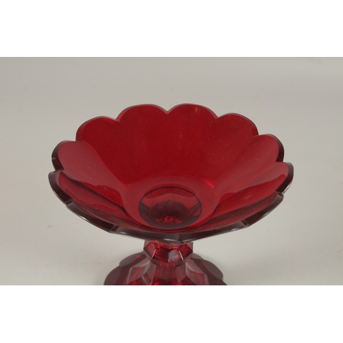 575 - A CUT GLASS RUBY TINTED TAZZA. 18cms diameter.