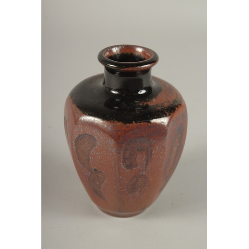 598 - A STUDIO POTTERY TAPERING HEXAGONAL SHAPE VASE, in the manner of Bernard Leach. 15cms high.