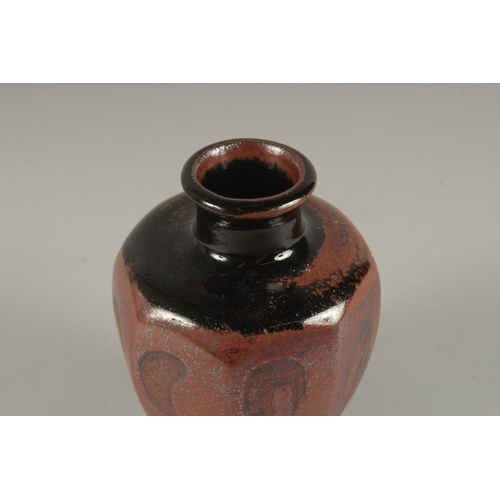 598 - A STUDIO POTTERY TAPERING HEXAGONAL SHAPE VASE, in the manner of Bernard Leach. 15cms high.