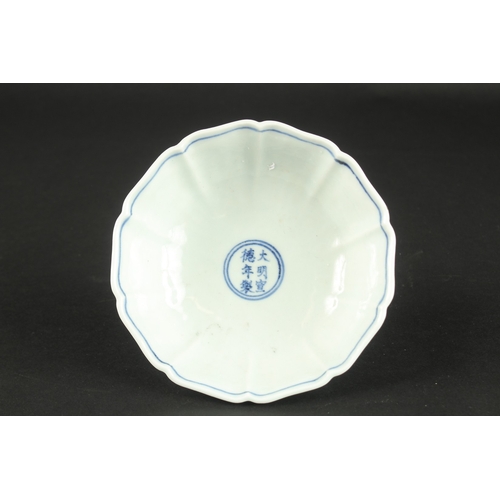 613 - A CHINESE BLUE AND WHITE PETAL SHAPE STEM CUP. 15.5cms wide.