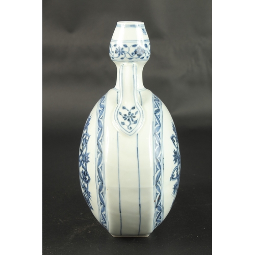 623 - A CHINESE BLUE AND WHITE PORCELAIN MOON FLASK. 31cms high.