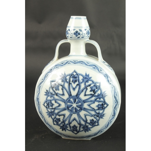 623 - A CHINESE BLUE AND WHITE PORCELAIN MOON FLASK. 31cms high.