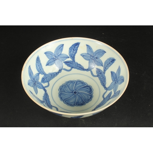 628 - A CHINESE BLUE AND WHITE FLORAL BOWL. 19cms diameter.