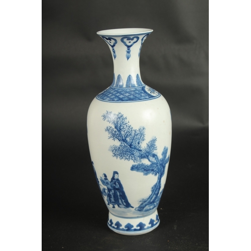 629 - A CHINESE BLUE AND WHITE VASE decorated with figures. 30cms high.