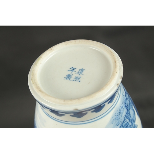 629 - A CHINESE BLUE AND WHITE VASE decorated with figures. 30cms high.