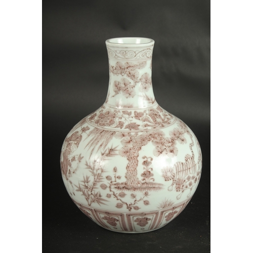 630 - A CHINESE UNDERGLAZE RED PORCELAIN VASE, painted with figures. 29cms high.